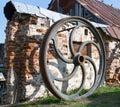 Large rusted metal industrial wheel against the background of an