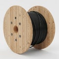 Large Wooden Cable Spool with Black Wire on White Background reel Royalty Free Stock Photo