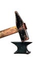 Large rusty hammer on a very small black anvil. Royalty Free Stock Photo