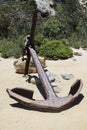 Large, rusty old boat anchor on the beach Royalty Free Stock Photo