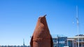 Large rusty penguin statue standing next to the bridge crossing at the Waterfront in Cape Town.