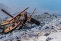 Large rusty ship anchors laying on side of seawall Royalty Free Stock Photo