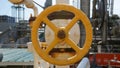 Large Rusty Yellow Heavy Industry Valve Wheel Royalty Free Stock Photo