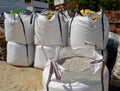 Large sacks of aggregates for making concrete mixes.