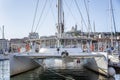 Large sailing catamaran in a marina in Marseille. Tourism and travel. Sunny day. Beautiful landscape