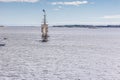 A large sailing frigate, barque or brig sails on a calm sea