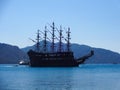 A large sailing ship sails in the sea bay