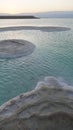 Large Salt accumulated on the shore of the Dead sea. Deposits of mineral salts, typical landscape of the Dead Sea. Salt on beach