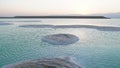 Large Salt accumulated on the shore of the Dead sea. Deposits of mineral salts, typical landscape of the Dead Sea. Salt on beach