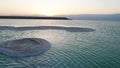 Large Salt accumulated on the shore of the Dead sea. Deposits of mineral salts, typical landscape of the Dead Sea. Salt on beach