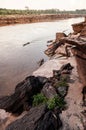 Large Sand stone canyon cliff shoreline of Mekong river on cloudy day at Ban Pha Chan, Ubon Ratchathani - Thailand