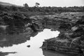 Large Sand stone canyon cliff shoreline of Mekong river on cloudy day at Ban Pha Chan, Ubon Ratchathani - Thailand