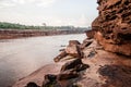 Large Sand stone canyon cliff shoreline of Mekong river on cloudy day at Ban Pha Chan, Ubon Ratchathani - Thailand