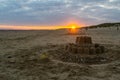 Large sandcastle on Camber Sands beach at sunset Royalty Free Stock Photo