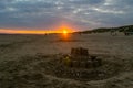 Large sandcastle on Camber Sands beach at sunset Royalty Free Stock Photo