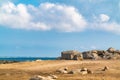 Large sandy beach with stone boulders. Asian vacations