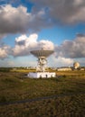 A large satellite dish pointing up into deep space