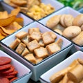 Large savoury snack food selection in porcelain bowls