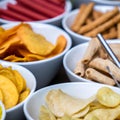 Large savoury snack food selection in porcelain bowls Royalty Free Stock Photo