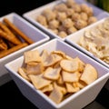 Large savoury snack food selection in porcelain bowls