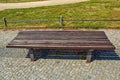 Large-scale brown wooden park bench