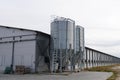 large scale commercial chicken farm with two grain storage silos for the storage of poultry feed Royalty Free Stock Photo