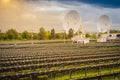 Large scale solar farm with the satellite dishes under dramatic Royalty Free Stock Photo