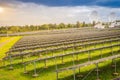 Large scale solar farm with the satellite dishes under dramatic Royalty Free Stock Photo