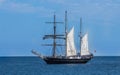 Large schooner sailboat yacht anchored in bay against blue sky Royalty Free Stock Photo