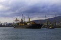 A large sea cargo ship container ship leaves the port. Royalty Free Stock Photo