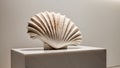 Large seashell sculpture displayed on a marble pedestal. Royalty Free Stock Photo