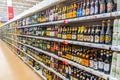 a large selection of beer drinks on the shelves of a supermarket. Royalty Free Stock Photo