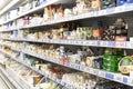 A large selection of different cheeses on the shelves in the store. Delicacies and gourmands. Side view. Moscow, Russia, 03-04-