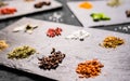 Large selection of different colorful contrast spices and seeds on slate Royalty Free Stock Photo