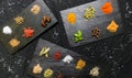 Large selection of different colorful contrast spices and seeds on slate Royalty Free Stock Photo