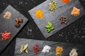 Large selection of different colorful contrast spices and seeds on slate Royalty Free Stock Photo