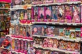 Shelves with dolls for children in a toy store. Minsk, Belarus, 2023