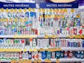 A large selection of tooth pastes, tooth rinse and oral care products on shelves in shopping mall