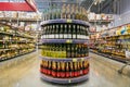 a large selection of various wines are on the shelf in a large supermarket. Royalty Free Stock Photo