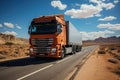 A large semi truck driving down a desert road during the day. European truck Royalty Free Stock Photo