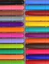 A large set of colorful felt-tip pens for drawing in a plastic box top view close-up, office background Royalty Free Stock Photo