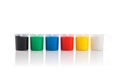 Large set of gouache paint cans in a row. Colorful paints isolated on white Royalty Free Stock Photo