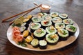 large set with sushi and rolls. sets of huge rolls size on white plates. huge plate with shushi Royalty Free Stock Photo