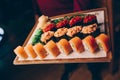 Large set of Sushi Rolls Warm Ebi Sake Unagi Spring. Assortment Philadelphia roll Dishes from Japanese raw fish in one plate in Royalty Free Stock Photo