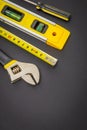 Large set of tools on black background prepared by the master before repair or construction Royalty Free Stock Photo