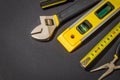 Large set of tools on black background prepared by the master before repair or construction Royalty Free Stock Photo