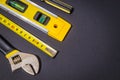 Large set of tools on black background prepared by the master before repair or construction Royalty Free Stock Photo