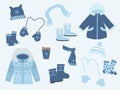 A large set of winter and autumn clothes for women and men. In blue colors, jackets, socks, scarf, mittens and winter Royalty Free Stock Photo