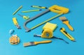 A large set of yellow hand tools on a blue background Royalty Free Stock Photo
