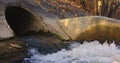 Large sewage tunnel with filth flowing out Royalty Free Stock Photo